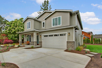 Photo of a mid-sized transitional two-storey grey exterior in Seattle with concrete fiberboard siding.