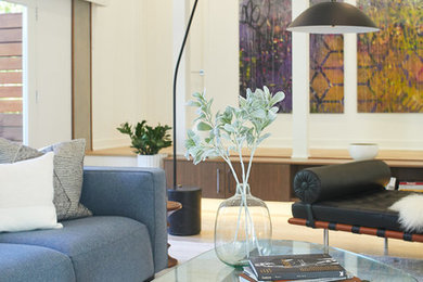 Large minimalist living room photo in Los Angeles with white walls