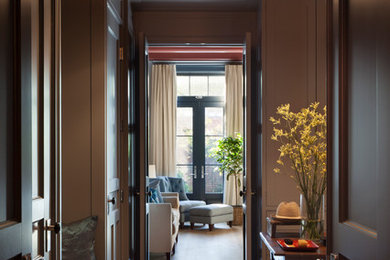 Inspiration for a traditional master bedroom in New York with grey walls, light hardwood floors and beige floor.