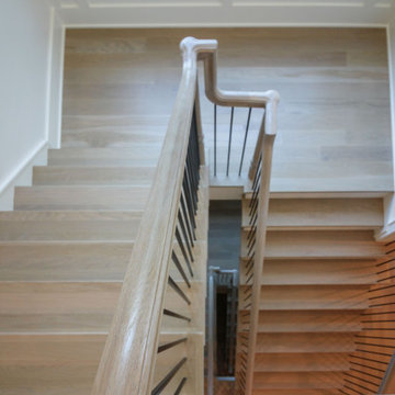 Project #93 | Captivating Staircase with Light Wood and Black Spindles