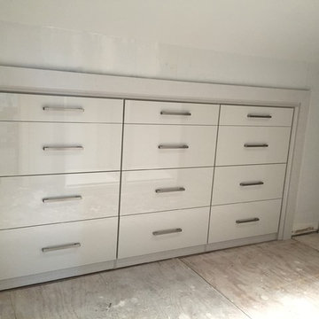 Contemporary Master Closet in high-gloss white and linen finish