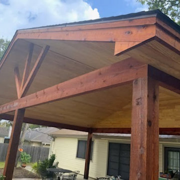 Rough cedar pergola with tongue and groove ceiling