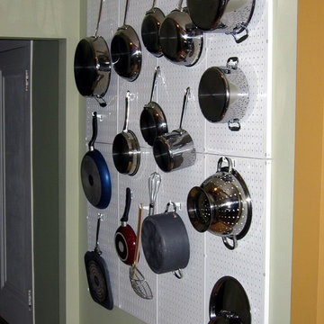 Pots and pan storage and organization with Wall Control white metal pegboard