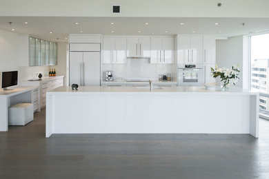 Inspiration for a kitchen remodel in Ottawa with a single-bowl sink, white backsplash and white countertops