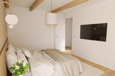 Imagen de dormitorio principal y beige y blanco nórdico de tamaño medio con paredes beige, suelo laminado y suelo beige