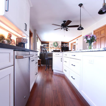 White Kitchen with Five Piece Drawer Fronts and Granite Countertop