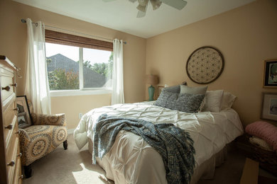 Example of a transitional bedroom design in Dallas