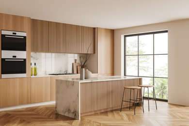 Large minimalist l-shaped multicolored floor eat-in kitchen photo in Dallas with an undermount sink, flat-panel cabinets, light wood cabinets, multicolored backsplash, quartz backsplash, stainless steel appliances, an island and multicolored countertops