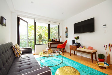 Example of a transitional living room design in New York