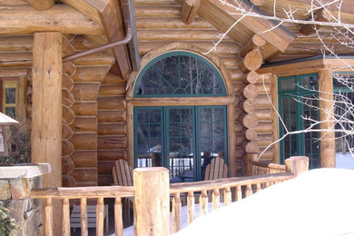 Example of a mountain style home design design in Denver