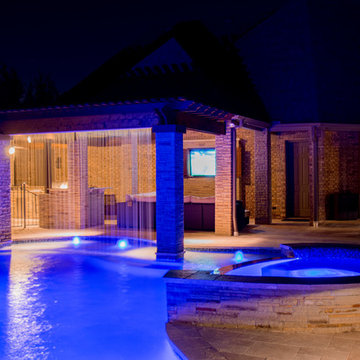 Transitional Curved Cool Pool with Amazing Water Features