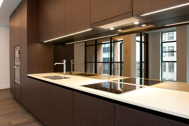 Kitchen - large modern kitchen idea in London