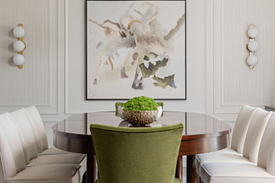 Example of a mid-sized transitional medium tone wood floor, brown floor and wall paneling kitchen/dining room combo design in Toronto with beige walls