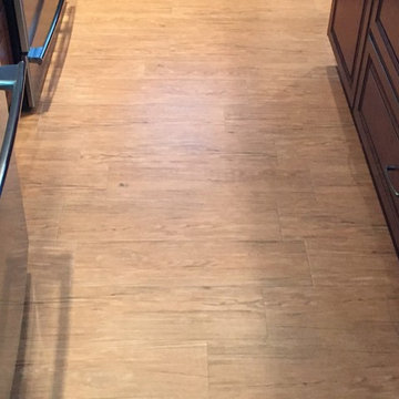 Harlequin backsplash with rustic wood floor