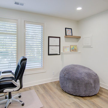 Warm & Inviting Basement Retreat with Kitchenette and Reading Nook