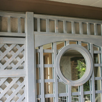 607 Mirrored treillage with distressed paint brightens up a dark porch
