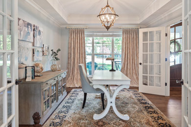 Example of a large transitional freestanding desk dark wood floor and brown floor study room design in DC Metro with gray walls