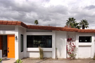 Example of a mid-sized southwest one-story house exterior design in Other