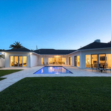 Modern Pool Courtyard with Seamless Indoor-Outdoor Living