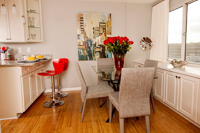 Inspiration for a mid-sized contemporary medium tone wood floor kitchen/dining room combo remodel in Kansas City with gray walls and no fireplace