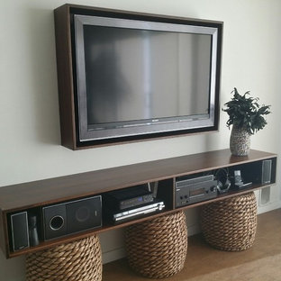 Design ideas for a medium sized modern open plan home cinema in Orlando with grey walls, cork flooring and a wall mounted tv.