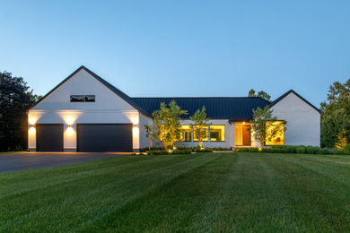 Example of a country home design design in Ottawa