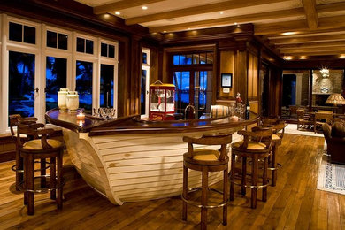 Photo of a large traditional home bar in Salt Lake City with dark hardwood floors, wood benchtops and brown benchtop.
