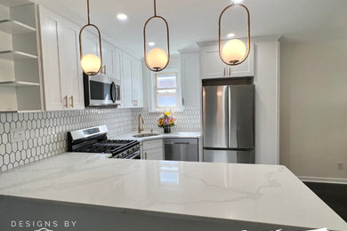 Example of a minimalist kitchen design in New York with shaker cabinets, white cabinets, quartz countertops, white backsplash, subway tile backsplash and white countertops