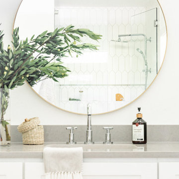 Bathroom Design Dallas – Vanity Detail with Round Mirror & Tile Shower View | La