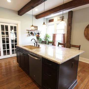 Painted Cream with Brown Glaze Cabinets with Giallo Granite Countertops ~ Sevill
