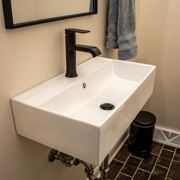 Powder Room with Wall Mounted Rectangular Sink and Black Hardware