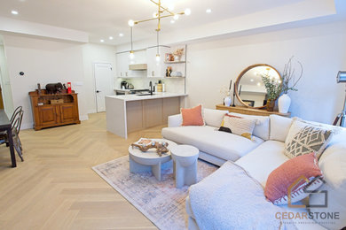 Living room - mid-sized modern open concept light wood floor and beige floor living room idea in Toronto with white walls, a standard fireplace, a stone fireplace and a wall-mounted tv