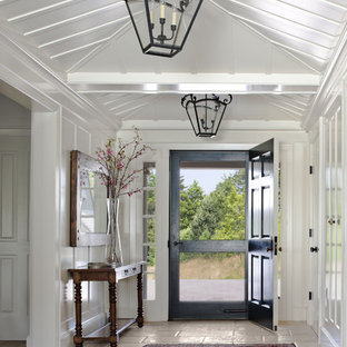 Photo of a country entryway in Boston with white walls, a single front door and a black front door.