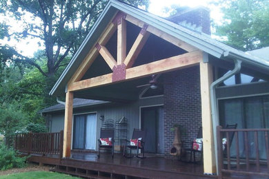 This is an example of a rustic porch design in Atlanta.