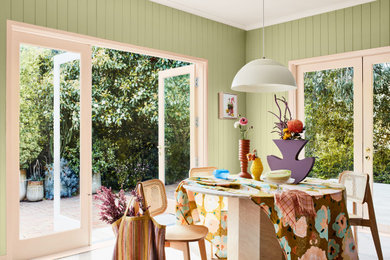 Design ideas for a dining room in Wellington with green walls.