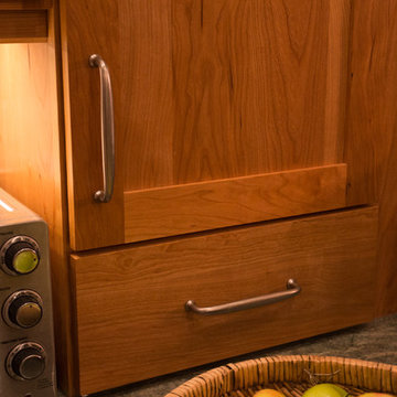 Warm Wood Kitchen Remodel | Natural Cherry Cabinetry, Granite Surfaces