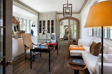 Study room - mediterranean dark wood floor study room idea in Phoenix with white walls