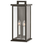 Hinkley - Weymouth 2-Light Outdoor Light In Oil Rubbed Bronze - Modernize your outdoor space without sacrificing the traditional appeal you long for. Weymouth's subtle yet overstated frame features a clean design, while its symmetrical lines evoke timeless elegance with a contemporary edge. The contrast candle sleeves in warm white balance the robust Black or Oil Rubbed Bronze aluminum cast frame. The beveled glass is an elegant touch to help refract the light.  This light requires 2 , 60W Watt Bulbs (Not Included) UL Certified.