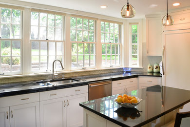 Eat-in kitchen - mid-sized modern u-shaped dark wood floor eat-in kitchen idea in Other with a double-bowl sink, shaker cabinets, white cabinets, granite countertops, metallic backsplash, metal backsplash, stainless steel appliances and an island