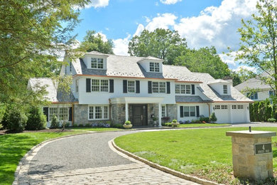 Inspiration for a large timeless white two-story mixed siding exterior home remodel in New York with a shingle roof