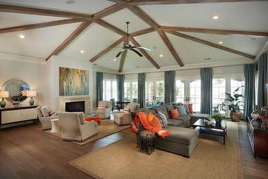 Large transitional open concept medium tone wood floor living room photo in Other with white walls, a standard fireplace, a concrete fireplace and a wall-mounted tv