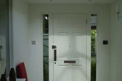 Photo of a mid-sized contemporary entryway in Other.