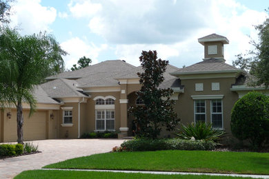 Example of a large eclectic home design design in Tampa