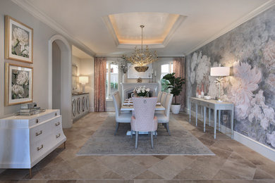 Huge transitional travertine floor and brown floor enclosed dining room photo in Orange County with multicolored walls, a standard fireplace and a stone fireplace