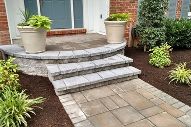 This is an example of a mid-sized traditional front yard concrete paver garden path in Philadelphia.