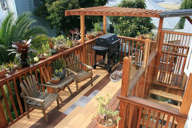 Example of a trendy deck design in San Francisco with a pergola and a bbq area