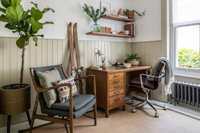 Inspiration for a medium sized classic study in Sussex with green walls, painted wood flooring, a freestanding desk, tongue and groove walls and a feature wall.