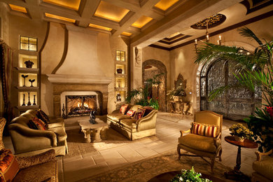 Inspiration for a large mediterranean formal and open concept porcelain tile living room remodel in Las Vegas with beige walls, a standard fireplace, no tv and a stone fireplace