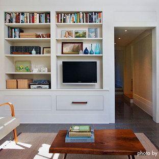 This is an example of a medium sized classic enclosed home cinema in Minneapolis with white walls, slate flooring and a wall mounted tv.