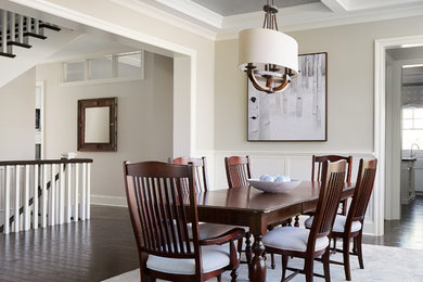 Mid-sized trendy dark wood floor enclosed dining room photo in Chicago with beige walls